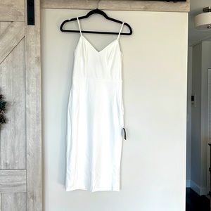 Super cute white dress with bows in the back